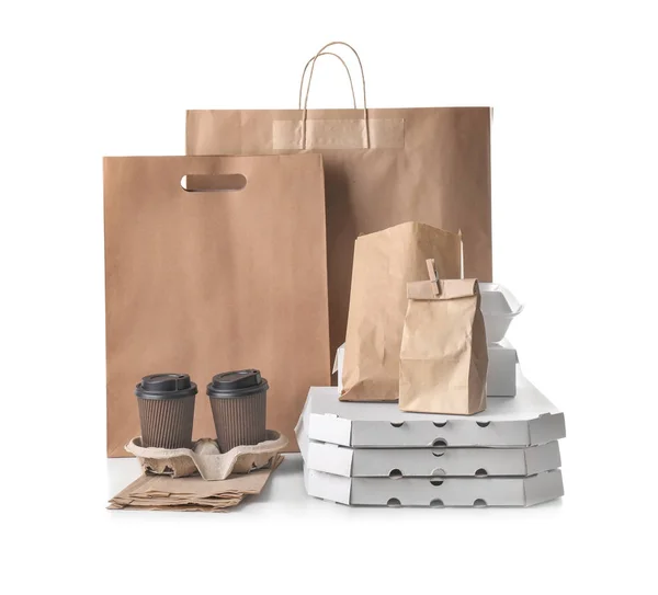 Different types of packages on white background. Food delivery service — Stock Photo, Image