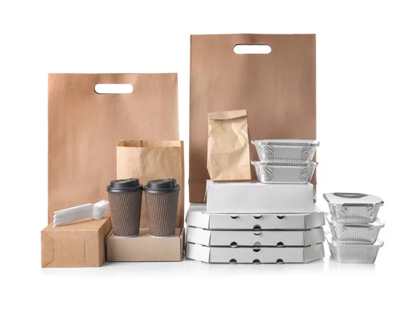 Different types of packages on white background. Food delivery service — Stock Photo, Image