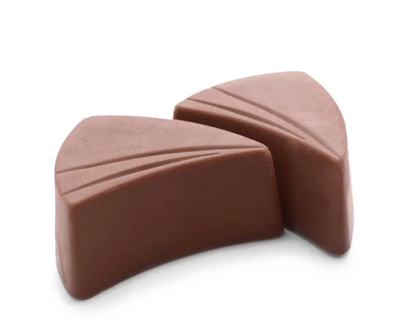 Doces de chocolate com leite saboroso no fundo branco — Fotografia de Stock