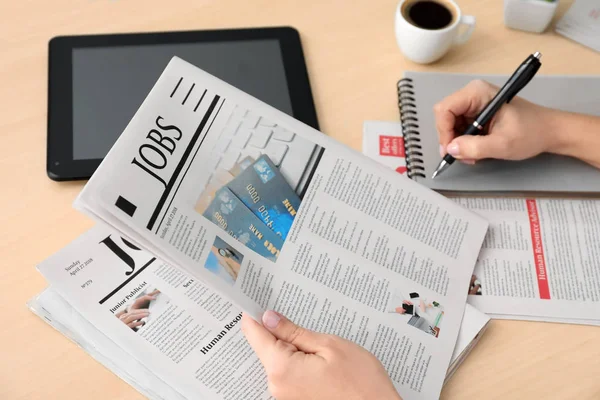 Woman looking for job in morning newspaper — Stock Photo, Image