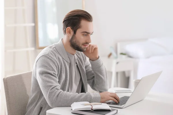 Male freelancer working with laptop in home office — Stock Photo, Image