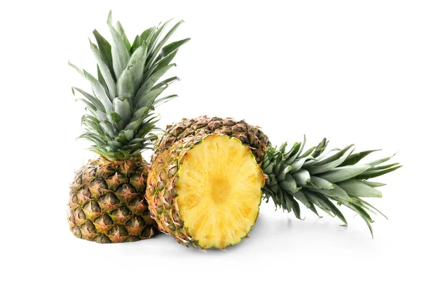 Delicious cut pineapples on white background — Stock Photo, Image