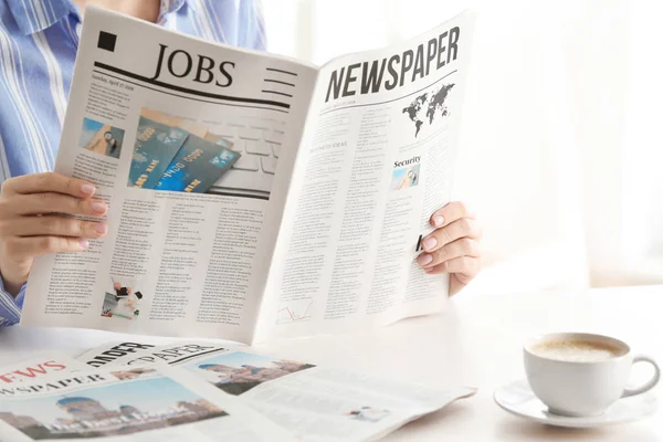 Woman reading morning newspaper indoors — Stock Photo, Image