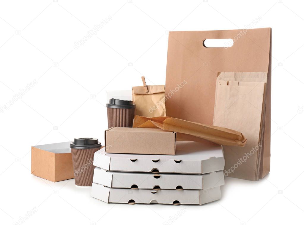 Different types of packages on white background. Food delivery service