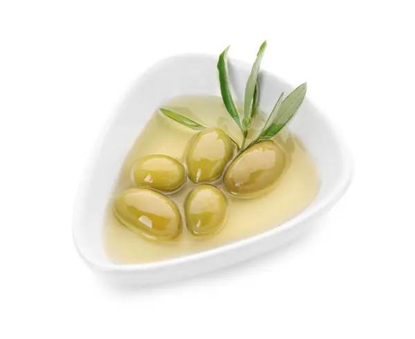 Bowl with olive oil on white background — Stock Photo, Image