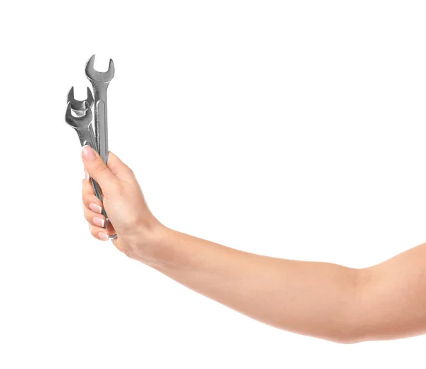 Hand of female car mechanic with wrenches on white background — Stock Photo, Image