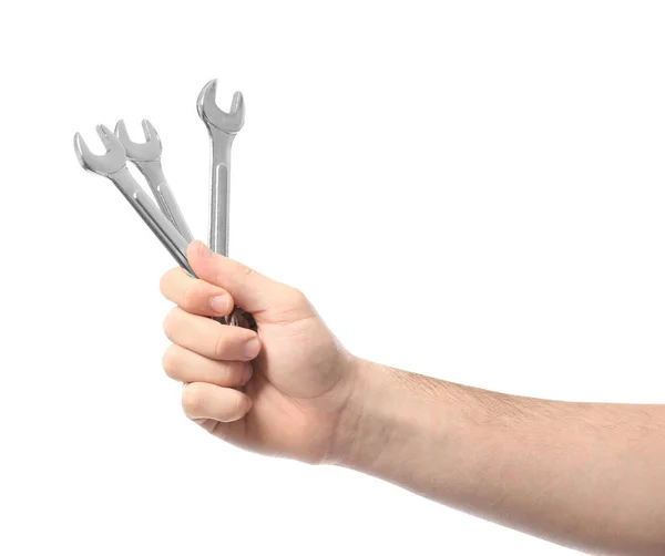 Hand of male car mechanic with wrenches on white background — Stock Photo, Image