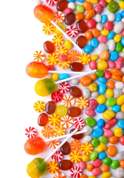 Tasty lollipops and colorful candies on white background — Stock Photo, Image