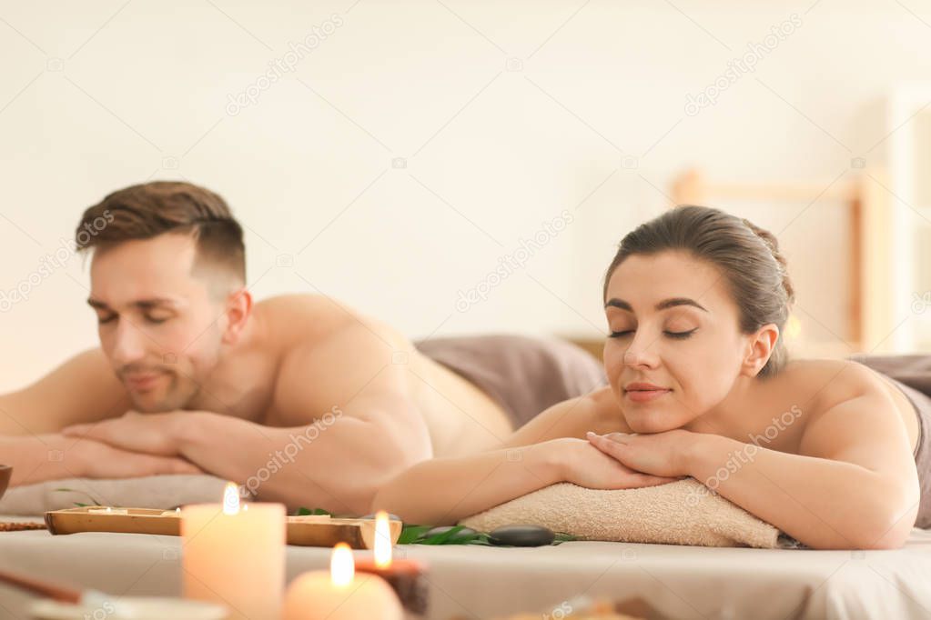 Young couple relaxing in spa salon