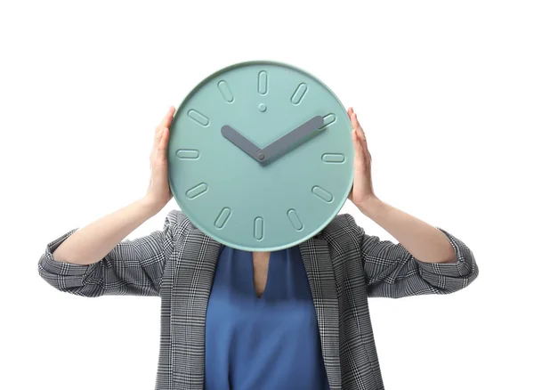 Vrouw gezicht achter de klok op een witte achtergrond te verbergen. Time management concept — Stockfoto