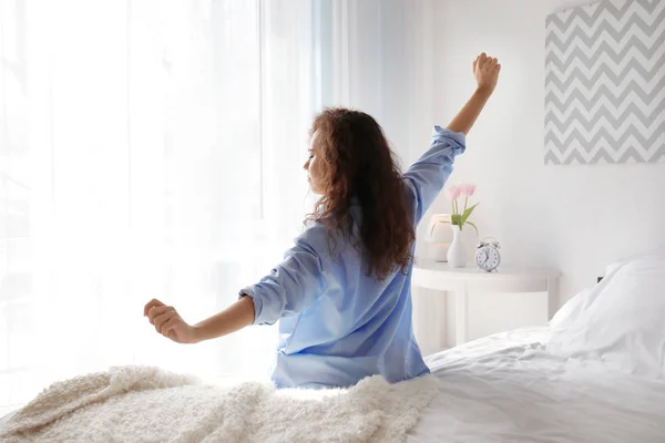 Morning of beautiful young woman in bedroom — Stock Photo, Image