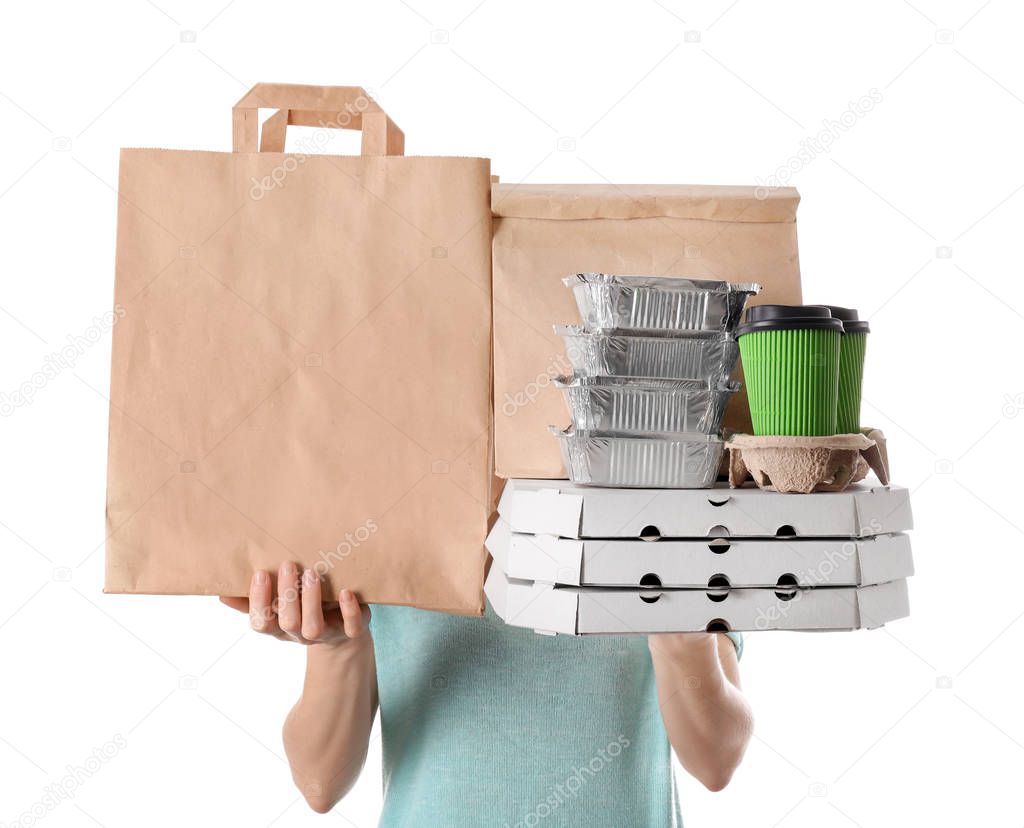 Woman with products in paper bags and containers on white background. Food delivery service