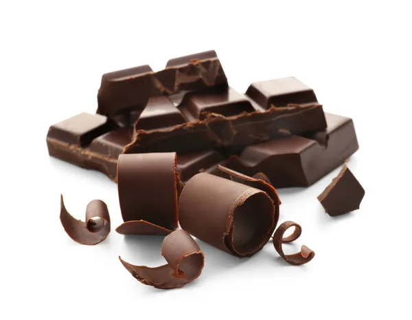 Pieces of chocolate with curls on white background — Stock Photo, Image