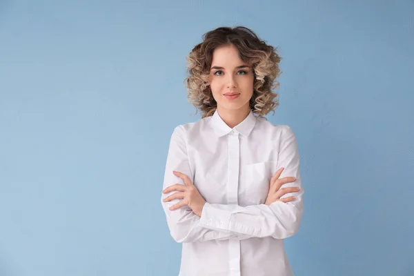 Portrait of beautiful young woman in formal clothes on color background — Stock Photo, Image