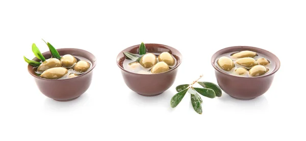 Bowls with canned olives on white background — Stock Photo, Image