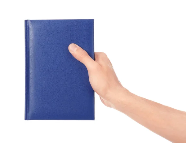 Mão masculina com livro sobre fundo branco — Fotografia de Stock