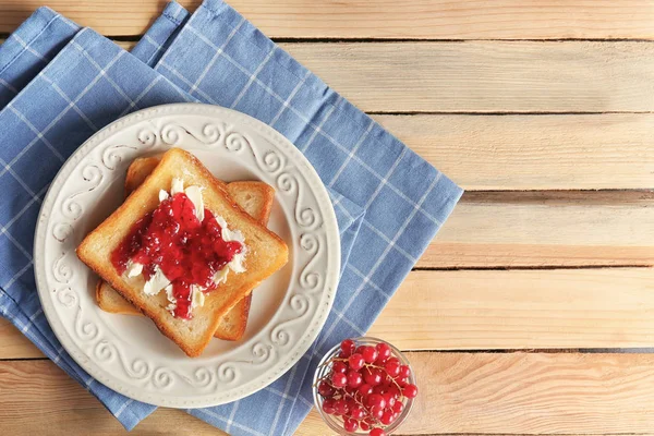Tasty toasts with sweet jam on plate — Stock Photo, Image