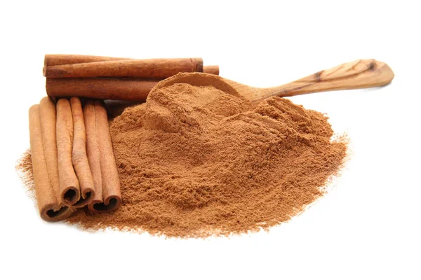 Cinnamon powder and sticks on white background — Stock Photo, Image