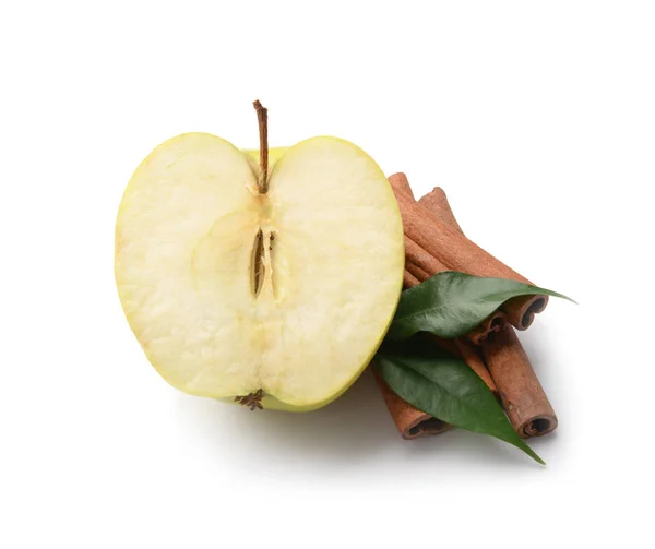 Half of fresh apple and cinnamon sticks on white background — Stock Photo, Image