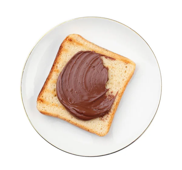 Toasted bread with chocolate paste on plate, isolated on white — Stock Photo, Image