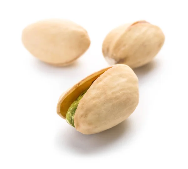 Tasty pistachio nuts on white background — Stock Photo, Image