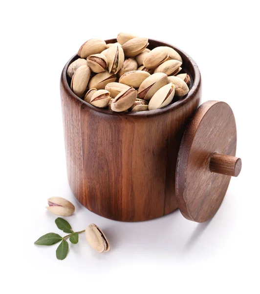 Jar with tasty pistachio nuts on white background — Stock Photo, Image