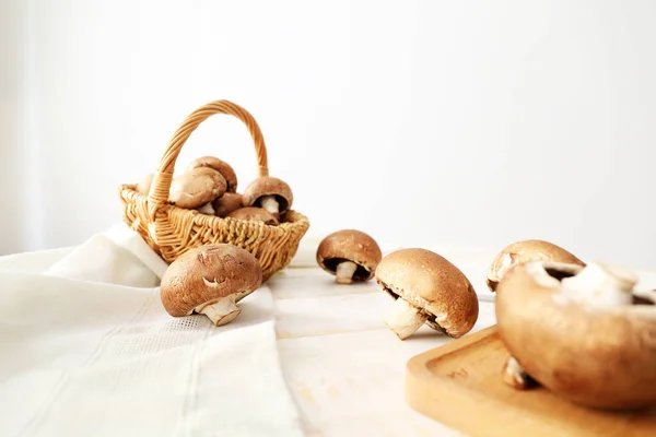Fresh champignon mushrooms on table — Stock Photo, Image