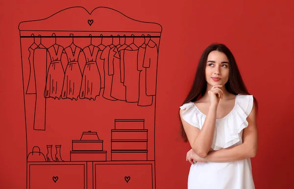 Thoughtful young woman imagining interior of dressing room — Stock Photo, Image