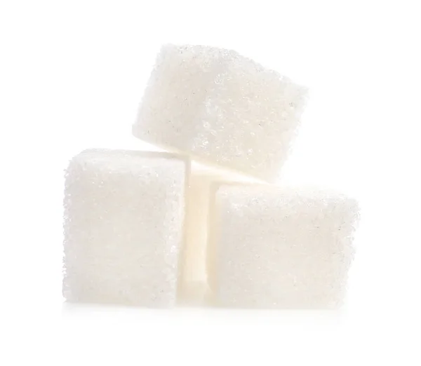 Cubos de azúcar dulce sobre fondo blanco — Foto de Stock