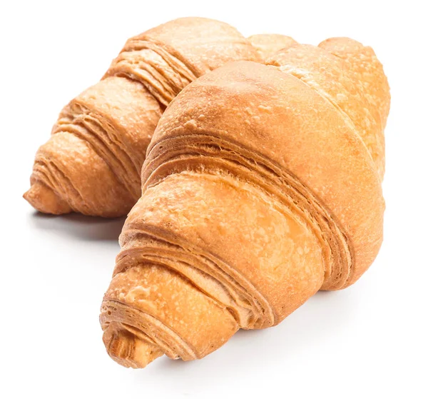 Söta välsmakande croissanter på vit bakgrund — Stockfoto