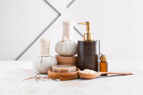 Cosmetics with herbal bags on white table — Stock Photo, Image