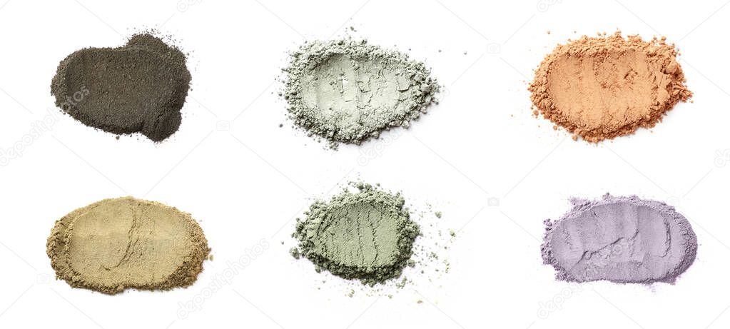 Different cosmetic clays on white background