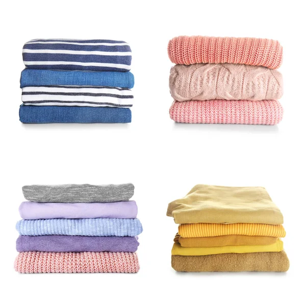 Stacks of modern different clothes on white background — Stockfoto