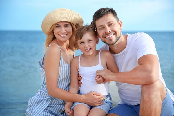 Portrait of happy family on sea beach — Stock Photo, Image