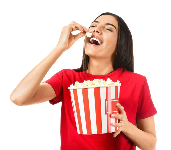 Young woman eating popcorn on white background — Stock Photo, Image