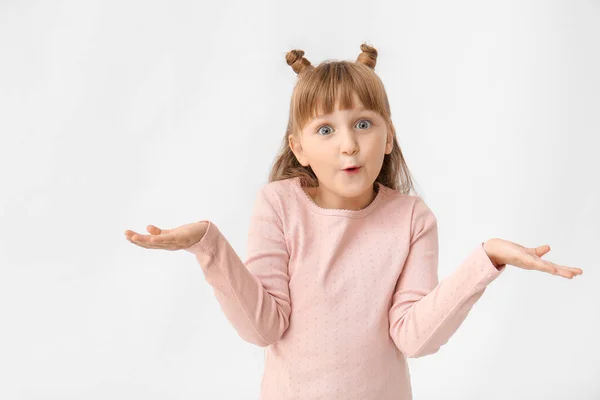 Surprised little girl on white background — Stock Photo, Image