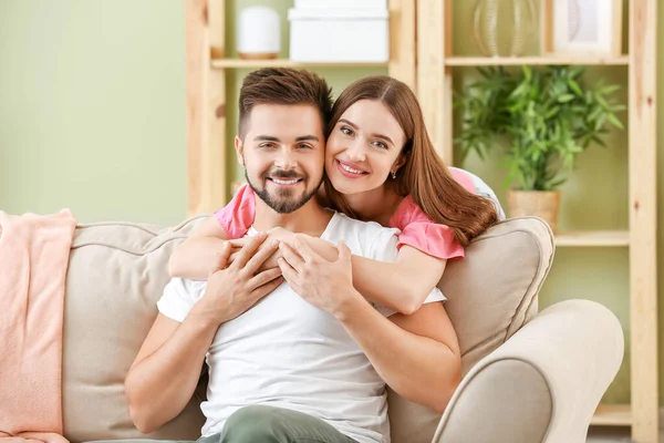 Portrait of happy young couple at home — Stock Photo, Image