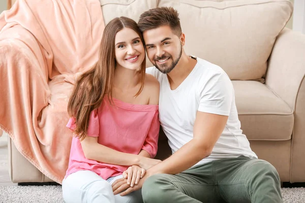 Portrait of happy young couple at home — Stock Photo, Image