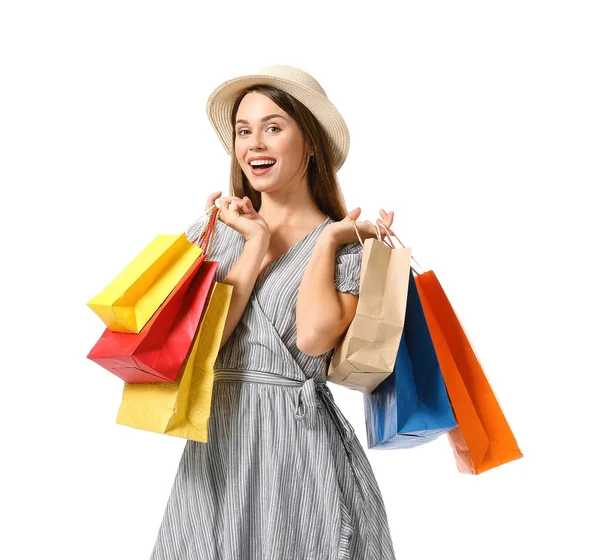 Beautiful young woman with shopping bags on white background — Stock Photo, Image