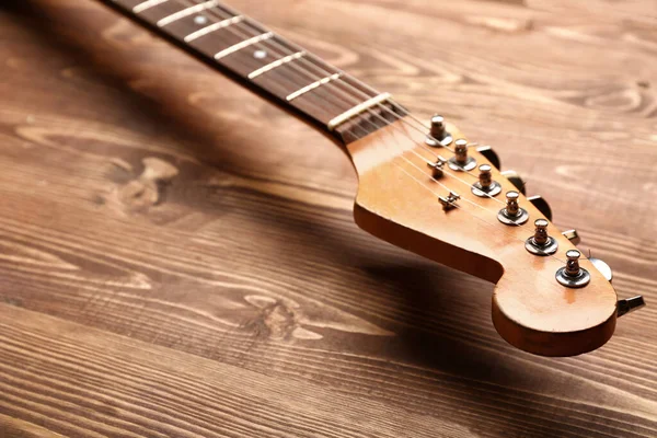 Modern guitar on wooden background — Stock Photo, Image