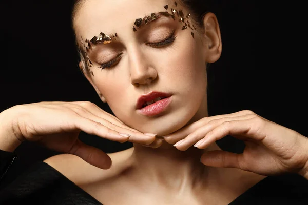 Young woman with creative eyebrows on dark background — Stock Photo, Image