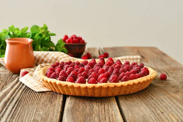 Sweet raspberry cake on wooden table — Stock Photo, Image