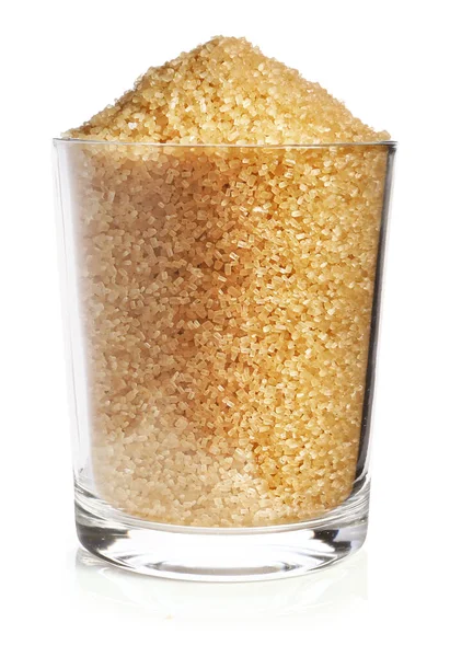 Glas braunen Zucker auf weißem Hintergrund — Stockfoto