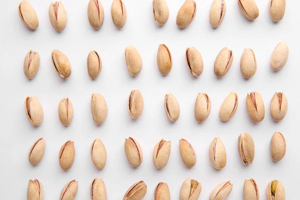 Tasty pistachio nuts on white background — Stock Photo, Image