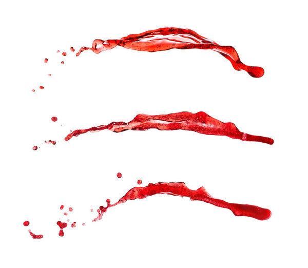 Всплески вина на белом фоне
