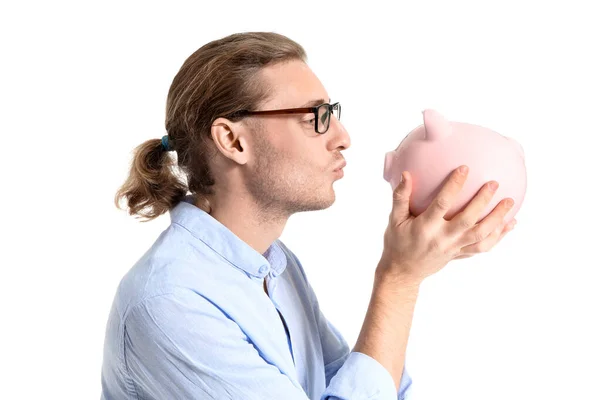 Guapo joven con alcancía sobre fondo blanco — Foto de Stock