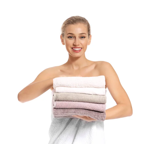 Beautiful young woman with clean towels on white background — Stock Photo, Image