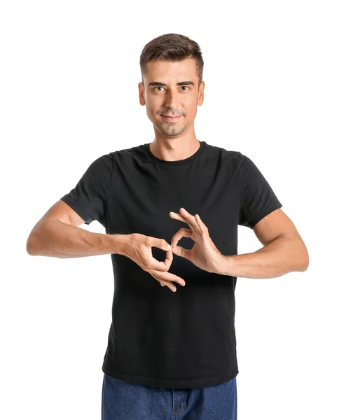 Young deaf mute man using sign language on white background — Stock Photo, Image