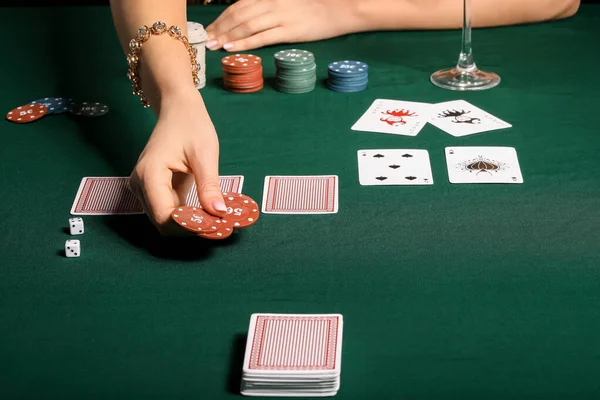 Female player at table in casino, closeup — Stock Photo, Image