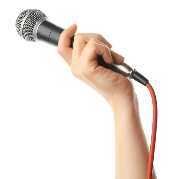 Weibliche Hand mit Mikrofon auf weißem Hintergrund — Stockfoto